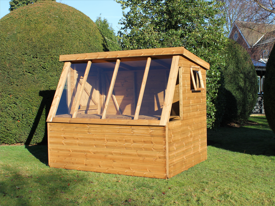 Wooden shed with long slanted windows, side opening window staging under windows, viewed from front/right side. 