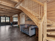 Interior view of the entrance / staircase area in the Priit residential log cabin