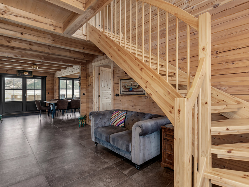Interior view of the entrance / staircase area in the Priit residential log cabin