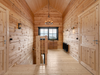 Interior view of the upper landing area in the Priit residential log cabin