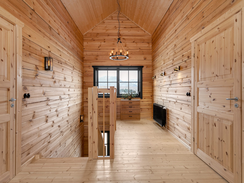 Interior view of the upper landing area in the Priit residential log cabin