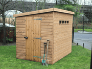 Wooden security shed with single door with padlock handle, pent style roof, security windows. Viewed from the front/right side. 