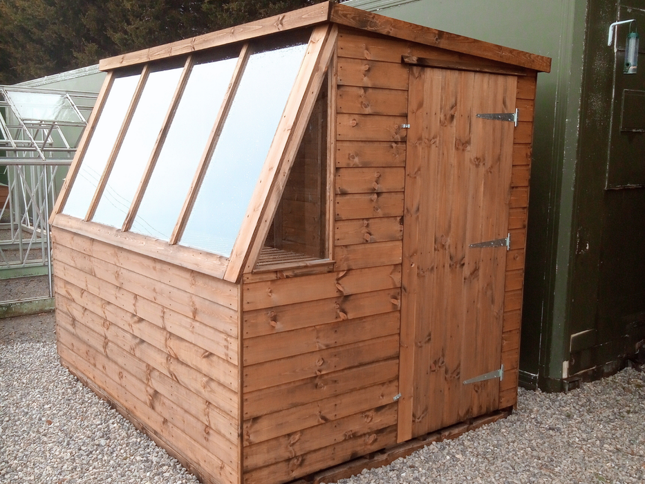Solar Potting Shed in a natural timber finish, viewed from the front of the building at an angle to the left