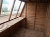 Interior view of the Solar Potting Shed in a natural timber finish