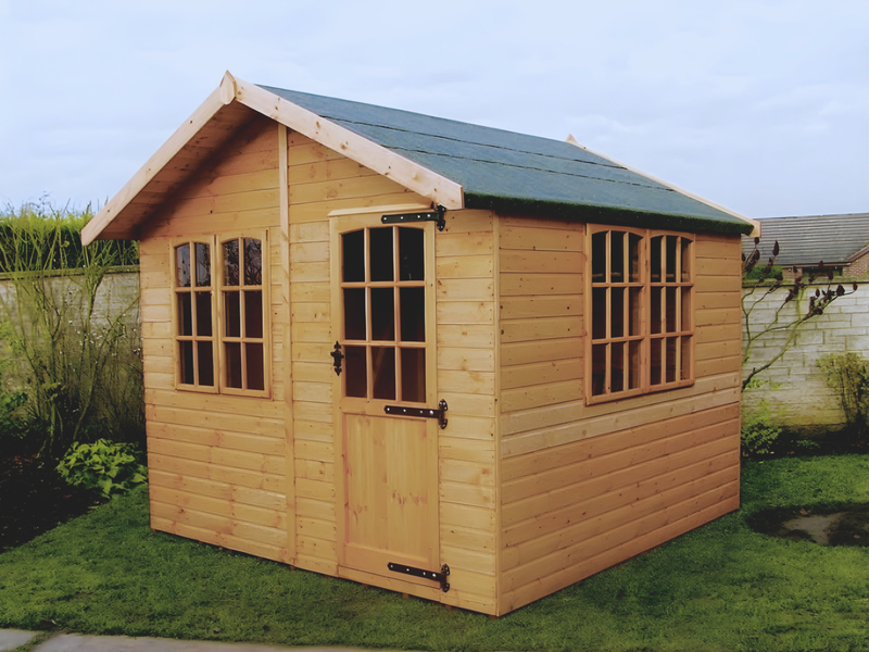 Large classic wooden summerhouse with large windows on front and side, single door at front. Viewed from the front/right side. 