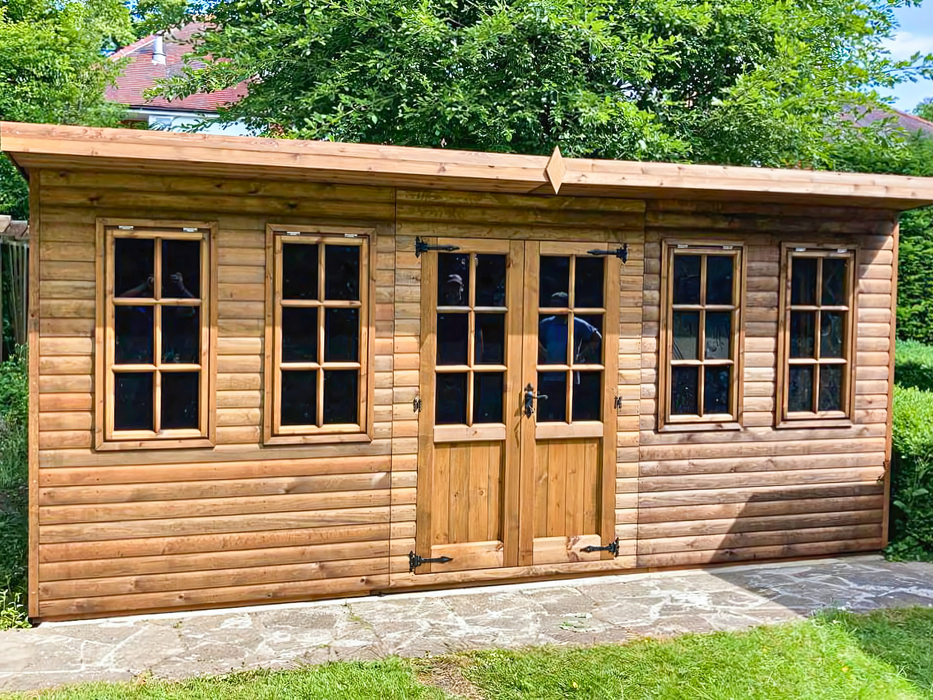 The Studio Summerhouse with double doors and four opening side windows, viewed from the front