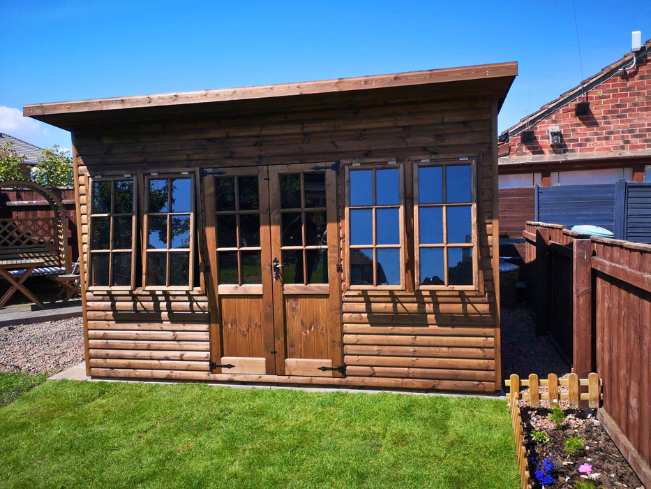 The Studio Summerhouse with double doors and four opening side windows, viewed from the front