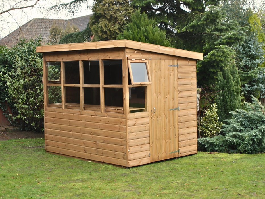 Classic wooden shed with side door, windows all along the front. Side opening windows on either side. Viewed from the front/right side. 