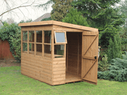 Classic wooden potting shed with side door, side opening windows, windows all along the front, slatted staging. Viewed from the front/right side. 