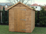 Supreme wooden shed with single door, viewed from the front. 