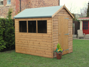 Supreme wooden shed with three side windows, single door, viewed from the left side. 