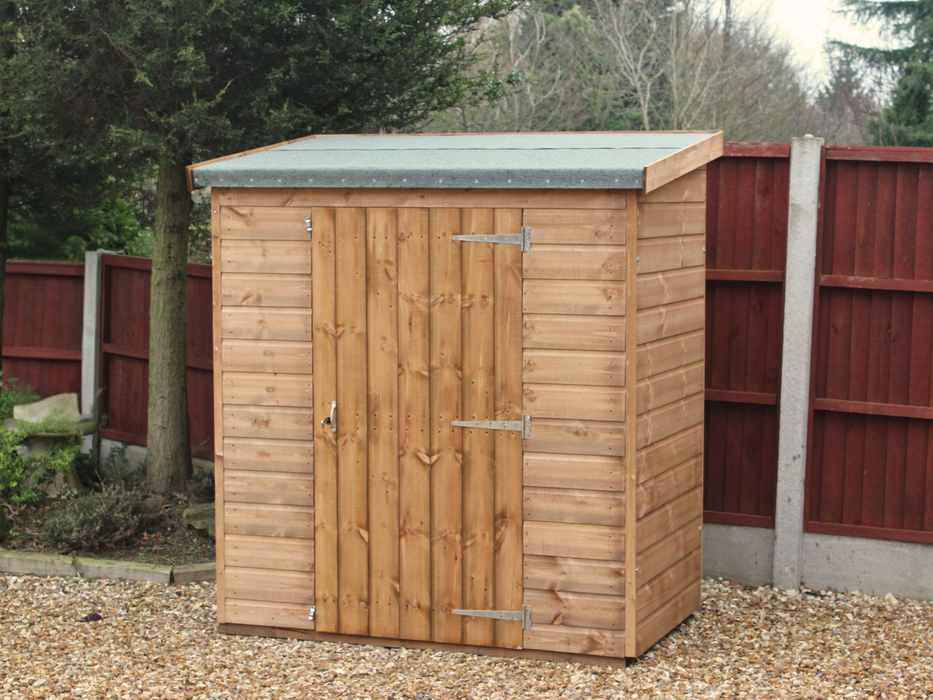 Small wooden tool shed with single door, viewed from the front. 