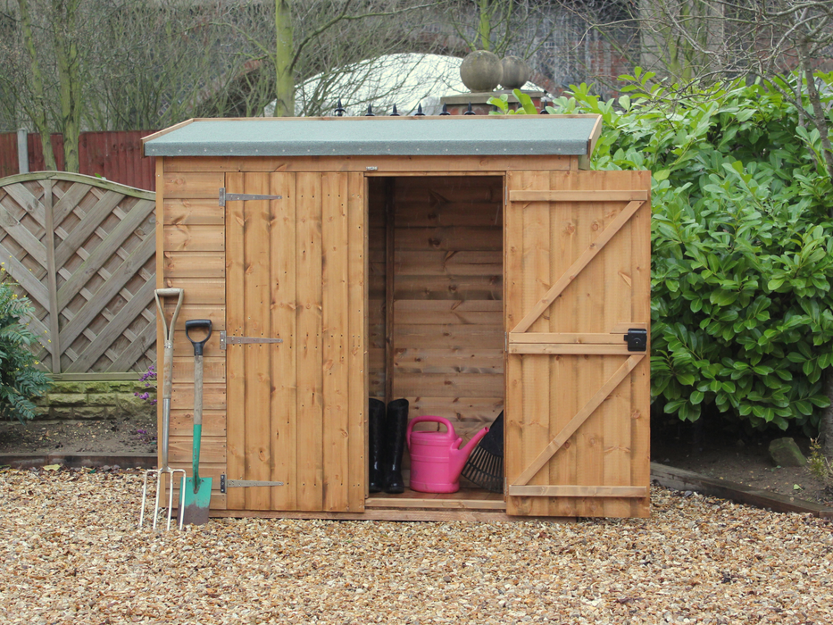 Small wooden tool shed with one door open, one shut, viewed from the front. 
