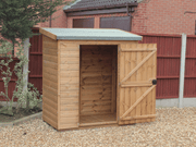 Small wooden tool shed with open single door, viewed from the front. 