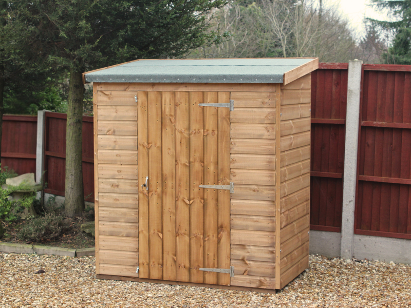 Small wooden tool shed with single door, viewed from the front. 