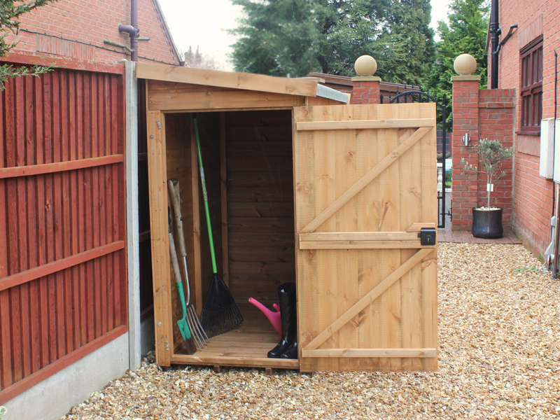 Small wooden tool shed with open single door, viewed from the left side. 