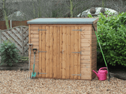 Small wooden tool shed with double doors, viewed from the front. 