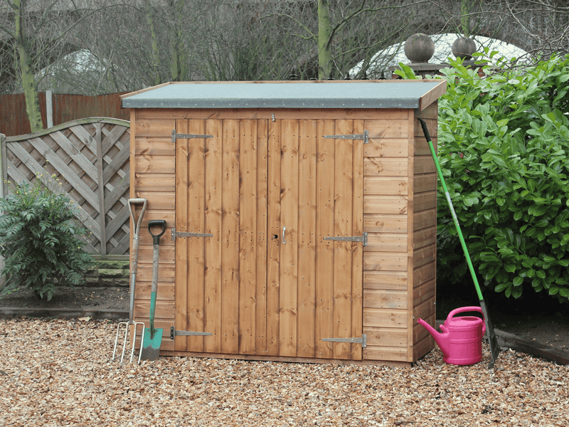 Small wooden tool shed with double doors, viewed from the front. 