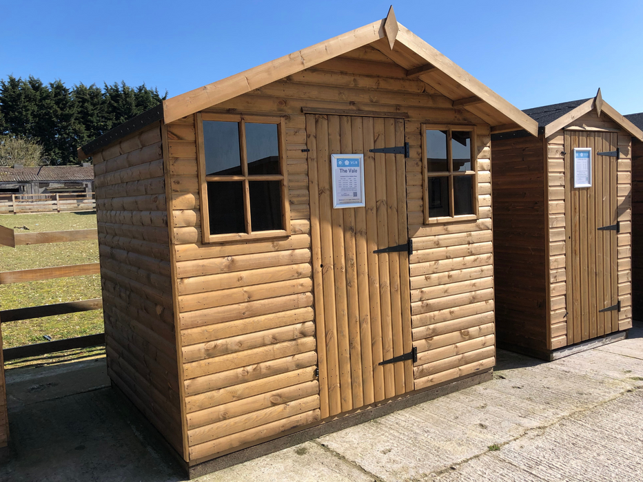 The Vale decorative garden shed with a single door and two Georgian side windows, viewed from the left