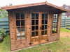 The Windsor Summerhouse with double doors and four opening side windows, viewed from the front