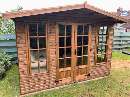 The Windsor Summerhouse with double doors and four opening side windows, viewed from the front