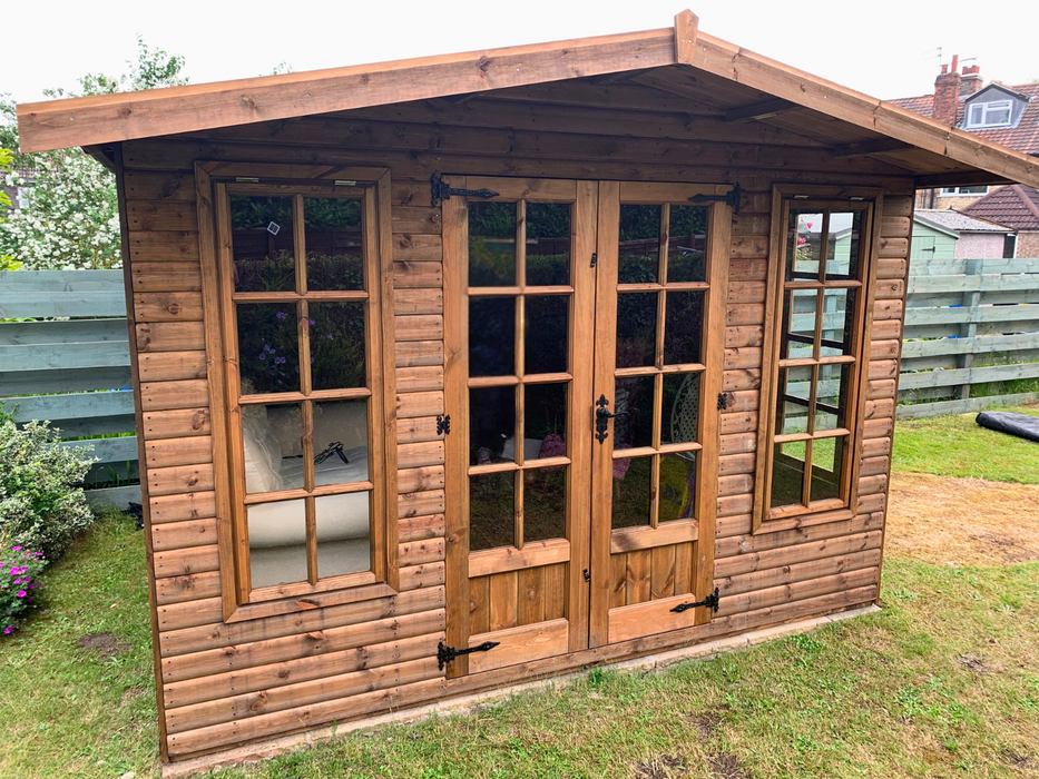 The Windsor Summerhouse with double doors and four opening side windows, viewed from the front
