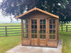 The Windsor Summerhouse with double doors and four opening side windows, viewed from the front