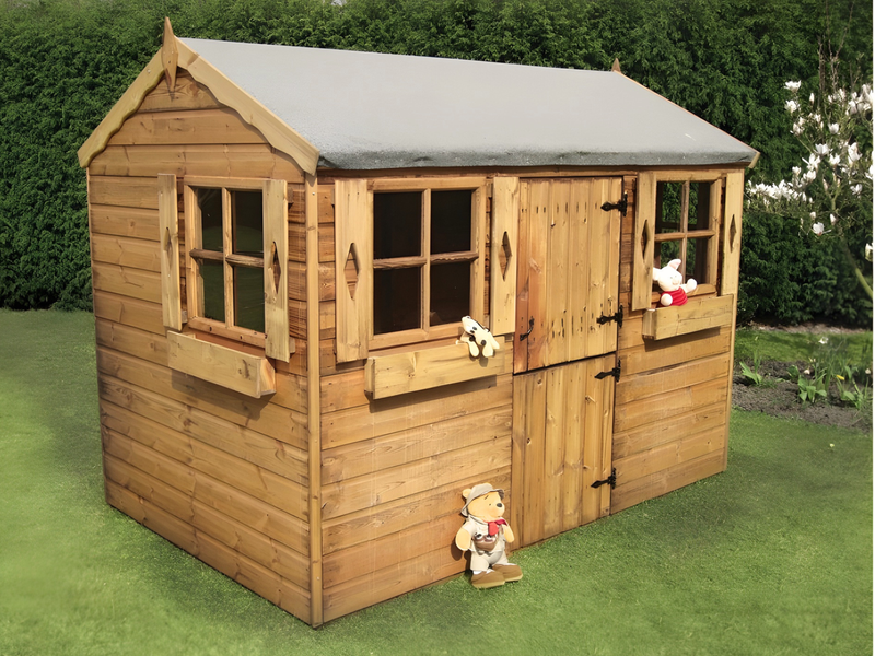 Wooden playhouse with stable door, four windows with boxes, viewed from the left/front. 