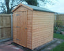 Standard Apex Shed in a garden 