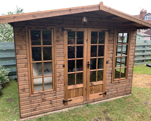 The Windsor summerhouse in a garden