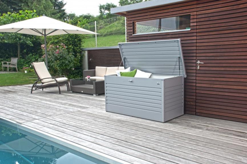 LeisureTime steel outdoor storage box being utilised as poolside cushion storage