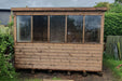 Lunar potting shed front view in a garden