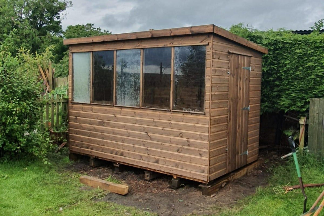 Lunar potting shed in a garden