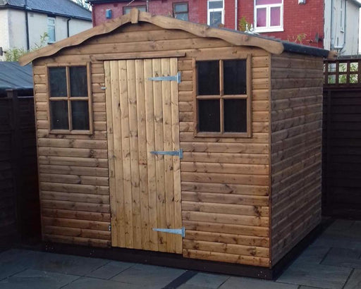 The Vale Apex Shed on a large patio